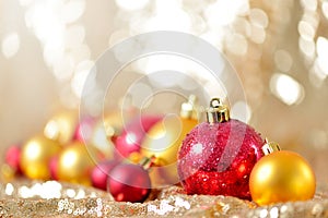 Christmas background, new year close up red and gold decoration balls on glitter abstract blurred holiday bokeh background