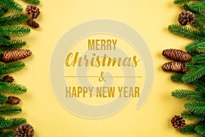 Christmas background, pine tree with xmas decoration on yellow background