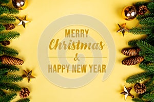 Christmas background, pine tree with xmas decoration on yellow background