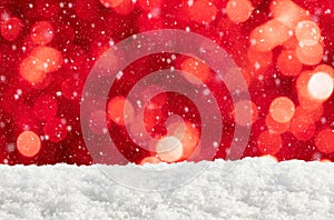 Christmas background with red lights, snowdrift and falling snow