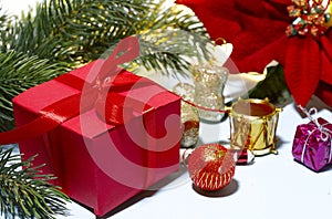 Christmas background. Red gift box with ribbon close-up.