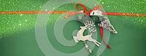 Christmas background with red silk traditional ribbon, white deer, evergreen tree and jingle bells. photo