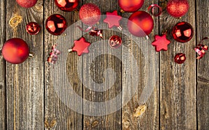 Christmas background with red toys and decorations on a wooden table. Christmas card. Baner. Flat layer. Top view with copy space