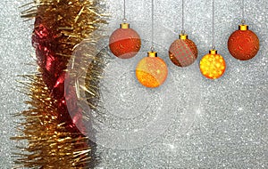 Christmas background with red and yellow ornament on a silver glitter background.