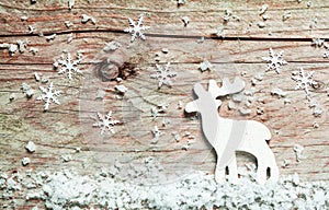 Christmas background with a reindeer in snow