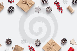 Christmas background with rustic gifts and and decor on white surface