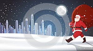Christmas Background Santa Claus Carry Bag Of Gifts Over Night Winter City Landscape Holidays Concept