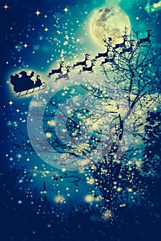 Christmas background. Silhouette of Santa Claus flying on a sleigh pulled by reindeer.