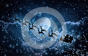 Christmas background. Silhouette of Santa Claus flying on a sleigh pulled by reindeer.