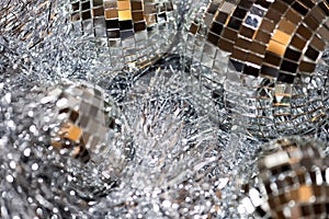 Christmas background with silver tinsel and mirror disco balls