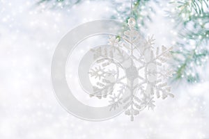 Christmas background, snowflake on a beautiful white background with snow.