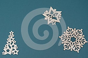 Christmas background with snowflakes .Wooden Christmas toys on a colored background. Christmas card