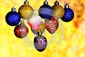 Christmas background of toys and glitter of bright rainbow bokeh lights, artistic decoration of merry winter new year holiday and