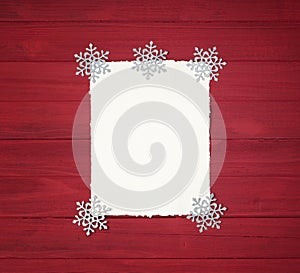 Christmas Background with Vintage Paper with ragged edges and Snowflake Decorations on Rustic, Shiplap Wood Boards with copy space