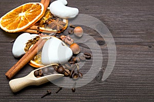 Christmas background: white gingerbread cookies, dried orange, cinamon, anise and cloves