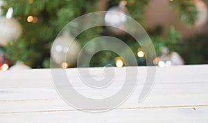 Christmas Background with White Wood Table and Lit Up Christmas Tree