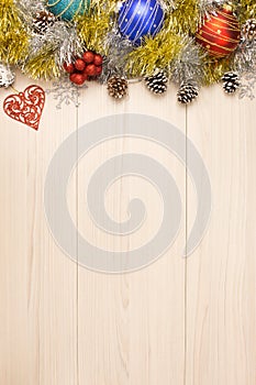 Christmas background on wooden table with copyspace. Top view of xmas tree pine cone and snowflake. fir branch silver