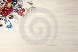 Christmas background on wooden table with copyspace. Top view of xmas tree pine cone and snowflake. fir branch silver