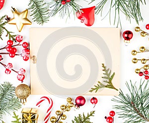 Christmas background with Xmas decorations and vintage paper card. Xmas flat lay top view