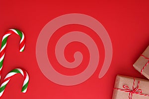 Christmas background with Xmas gifts and candy canes. Top view, flat lay. Copy space for text