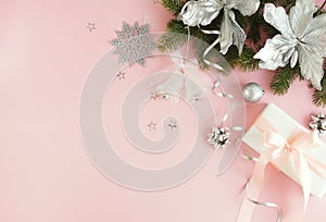 Christmas background . Xmas or new year white silver color decorations on pastel pink background