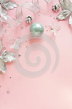 Christmas background . Xmas or new year white silver color decorations on pastel pink background