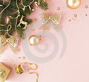 Christmas background. Xmas or new year white silver color decorations on pastel pink background with empty copy space for text.