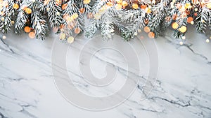 Christmas background with xmas tree on white marble background. Merry christmas greeting card, frame, banner. Winter holiday theme