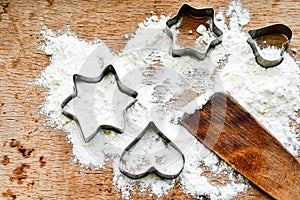 Christmas baking background with flour, cookie cutter