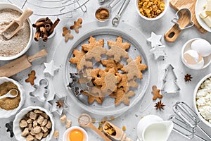 Christmas baking culinary background. Xmas gingerbread on kitchen table and ingredients for cooking festive cookies