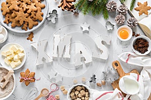 Christmas baking culinary background. Xmas gingerbread on kitchen table and ingredients for cooking festive cookies