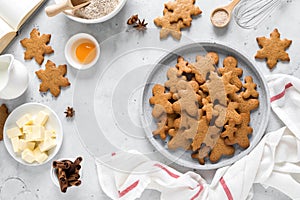 Christmas baking culinary background. Xmas gingerbread on kitchen table and ingredients for cooking festive cookies