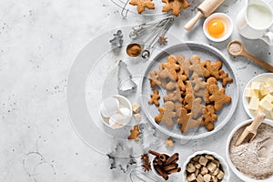 Christmas baking culinary background. Xmas gingerbread on kitchen table and ingredients for cooking festive cookies