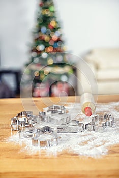 Christmas baking shapes with flour and roller