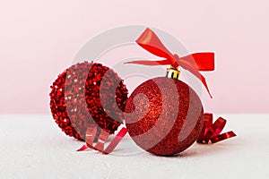 Christmas ball on colored background. decoration bauble with ribbon bow with copy space