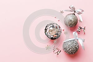 Christmas ball on colored background. decoration bauble with ribbon bow with copy space