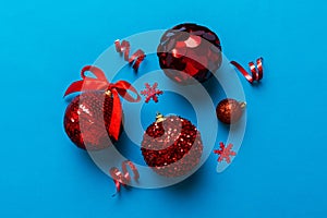 Christmas ball on colored background. decoration bauble with ribbon bow with copy space