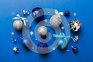 Christmas ball on colored background. decoration bauble with ribbon bow with copy space