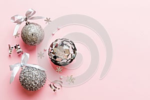 Christmas ball on colored background. decoration bauble with ribbon bow with copy space