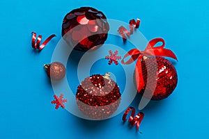 Christmas ball on colored background. decoration bauble with ribbon bow with copy space