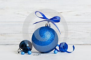 Christmas ball on colored background. decoration bauble with ribbon bow with copy space