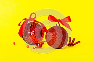 Christmas ball on colored background. decoration bauble with ribbon bow with copy space