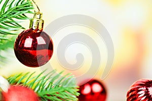 Christmas ball decoration for pine tree with red balls holiday light gold background / christmas tree festive xmas winter and