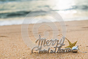 Christmas ball decorations on the sand of tropical ocean beach