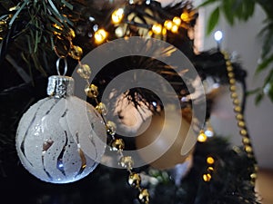 Christmas ball decorations on the Xmas tree during holidays.