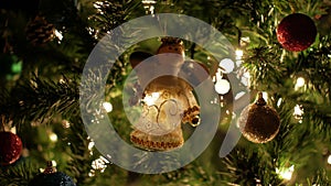 Christmas ball, fairy garland on Christmas tree with bokeh lights