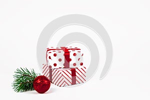 Christmas ball, gifts and green spruce branches  on white background. Isolate. Holidays christmas background. Copy space