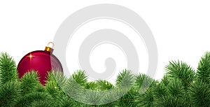 Christmas ball on green fir tree branch isolated on white.