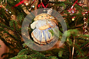 Christmas ball with the image of the girl-angel