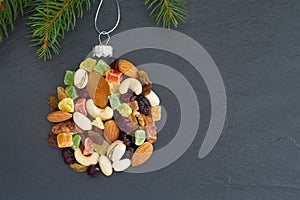 Christmas ball made of mix nuts and dried fruit, baking christmas background concept